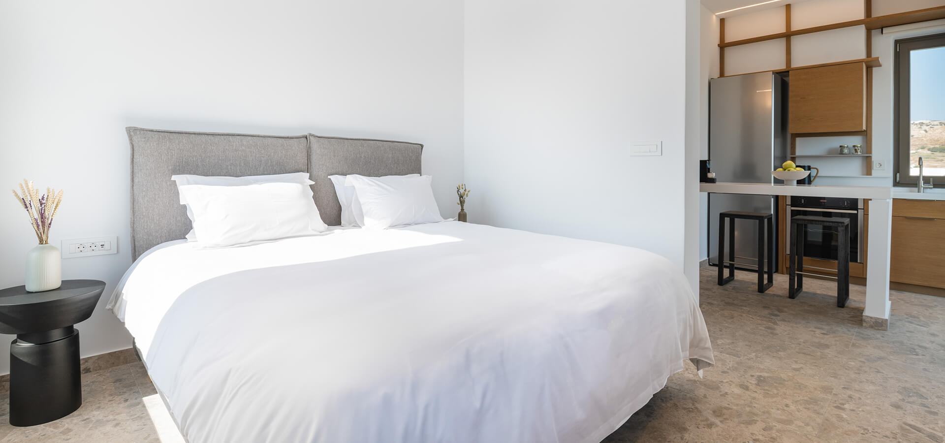 Indoor space of a private space in Omvrodektis Village with bedroom and kitchenette